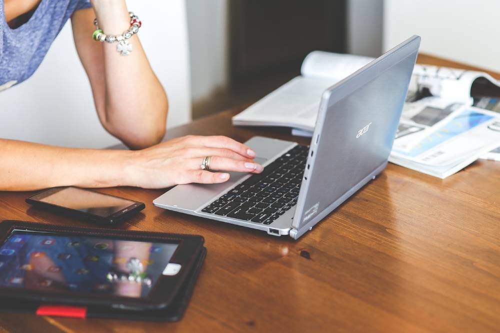 Illustration of a person crafting messages on a laptop